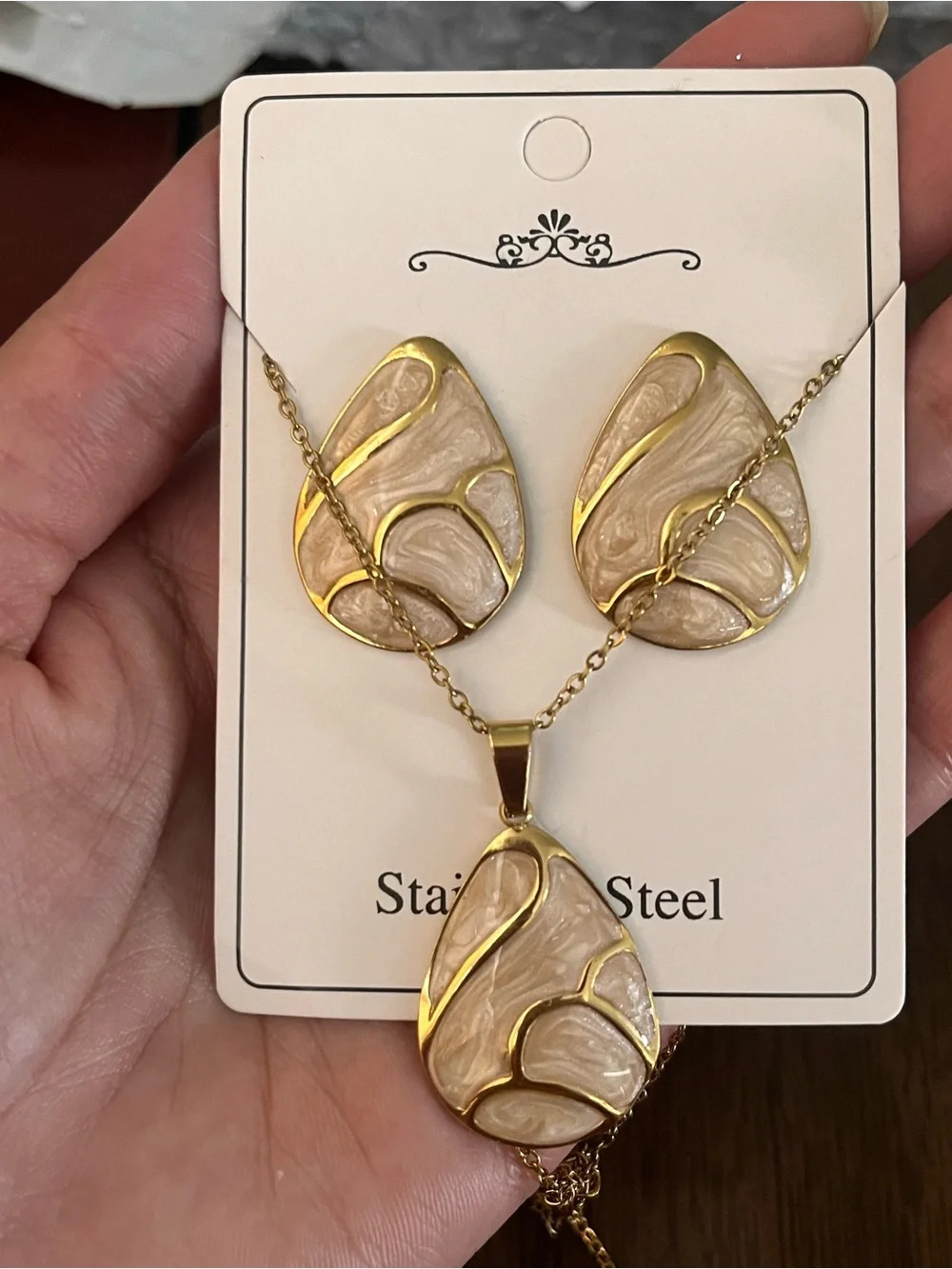 Set Earrings and necklace, gold tone and beige, waterproof.